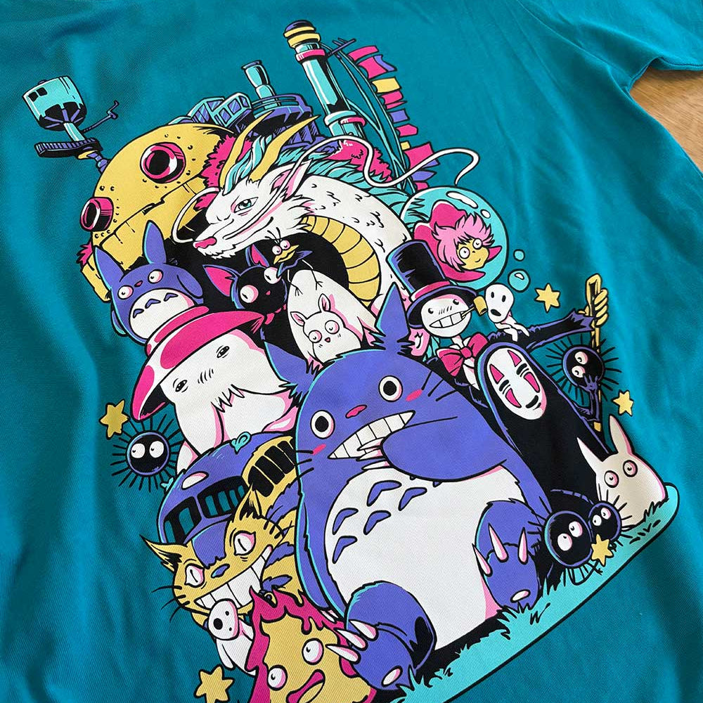 Teal t-shirt with colourful Studio Ghibli character design