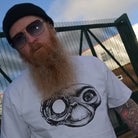 Man wearing a white t-shirt with a black and white ET Terminator mashup design