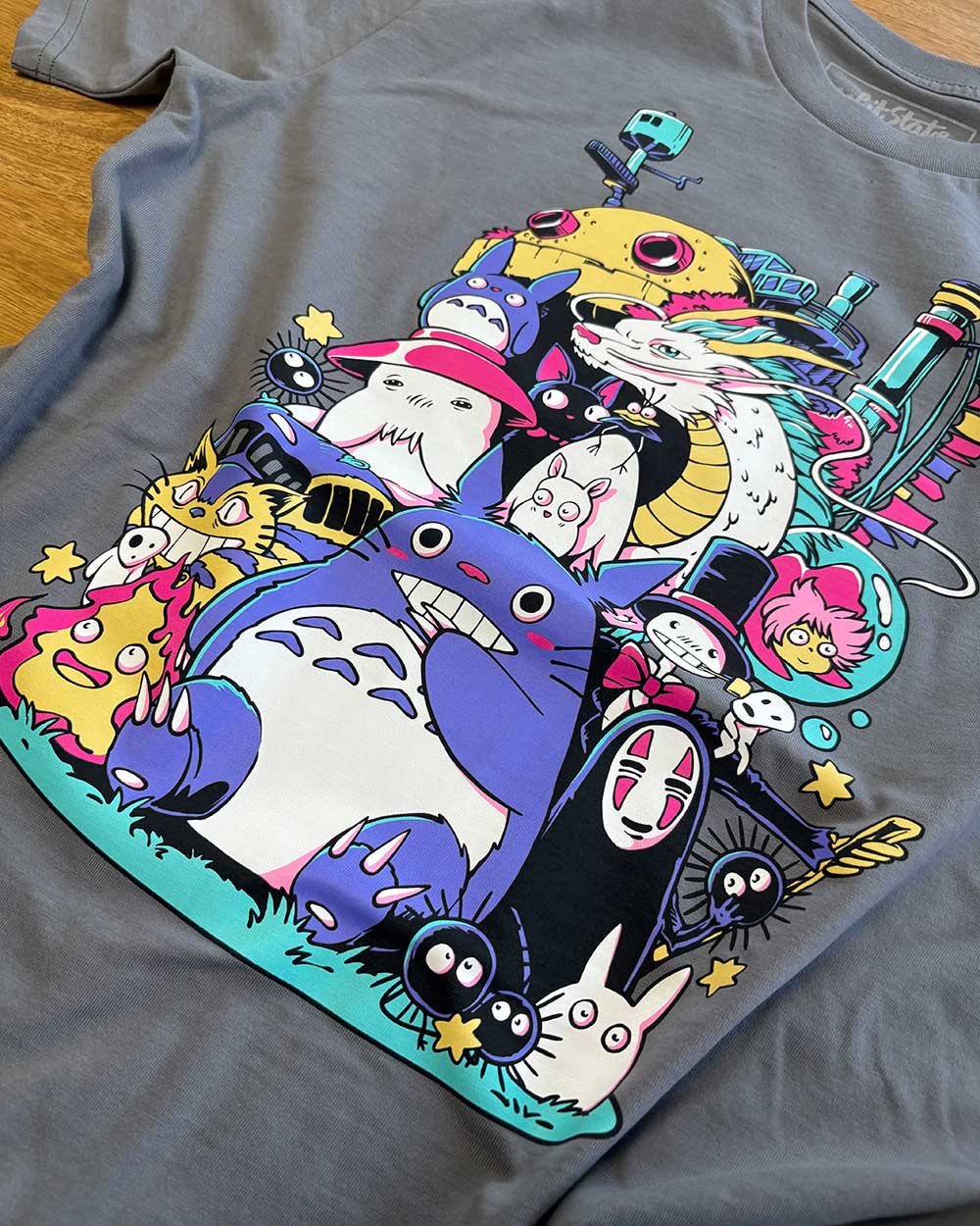Gray t-shirt with colourful Studio Ghibli character design 