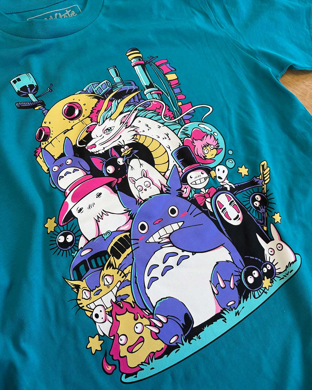 Teal t-shirt with colourful Studio Ghibli character design